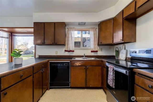 913 Woodlawn, Walla Walla, WA 99362 - kitchen with black dishwasher, electric stove, dark countertops, and healthy amount of natural light