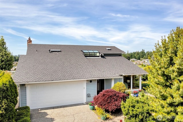 14007 65th Pl W, Edmonds, WA 98026 - view of front of home with concrete driveway, roof with shingles, a chimney, and an attached garage