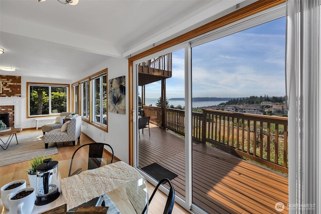 14007 65th Pl W, Edmonds, WA 98026 - sunroom / solarium featuring wood finished floors, beamed ceiling, and a deck with water view