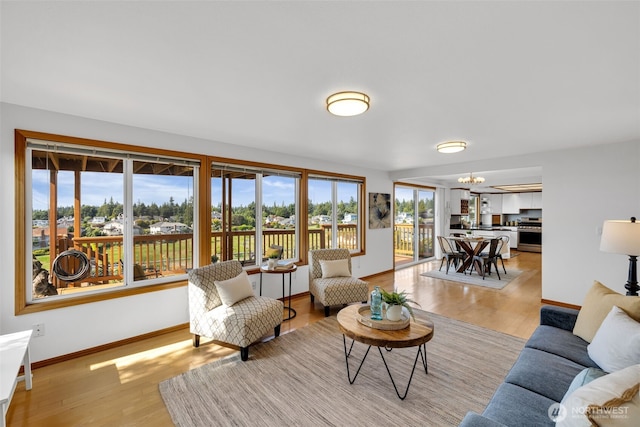 14007 65th Pl W, Edmonds, WA 98026 - living area with a chandelier and light wood-style flooring