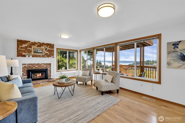 14007 65th Pl W, Edmonds, WA 98026 - living area featuring light wood-style floors and a brick fireplace