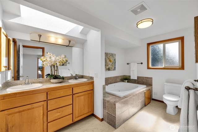 14007 65th Pl W, Edmonds, WA 98026 - bathroom featuring double vanity, a garden tub, and marble finish flooring