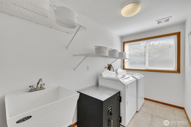 14007 65th Pl W, Edmonds, WA 98026 - laundry room with washer and clothes dryer and light tile patterned flooring