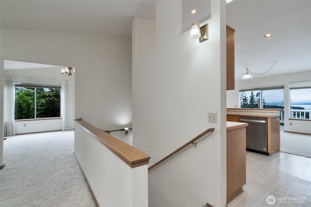 4303 Glasgow Way, Anacortes, WA 98221 - hallway featuring an upstairs landing, light carpet, a chandelier, and recessed lighting