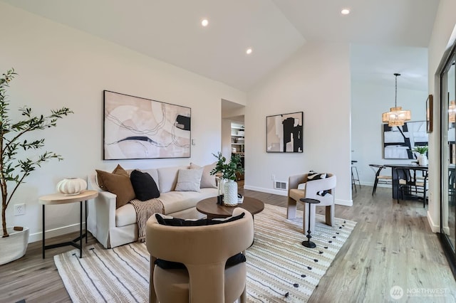 12200 100th Ave NE Unit N-D, Kirkland, WA 98034 - living area featuring light wood-type flooring, a chandelier, high vaulted ceiling, and recessed lighting