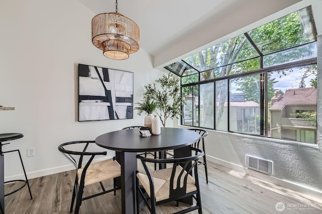 12200 100th Ave NE Unit N-D, Kirkland, WA 98034 - dining space featuring baseboards and wood finished floors