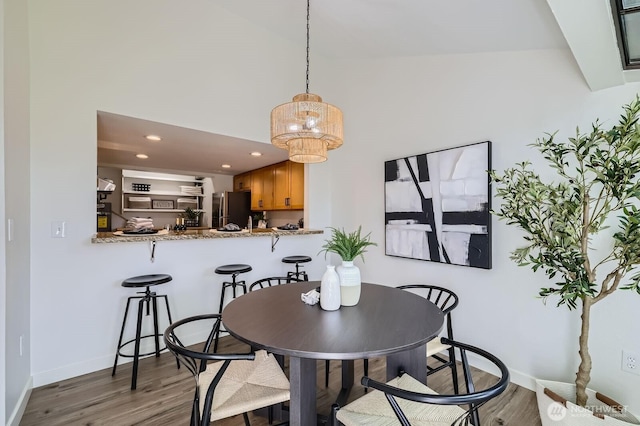 12200 100th Ave NE Unit N-D, Kirkland, WA 98034 - dining area featuring wood finished floors, a chandelier, and recessed lighting
