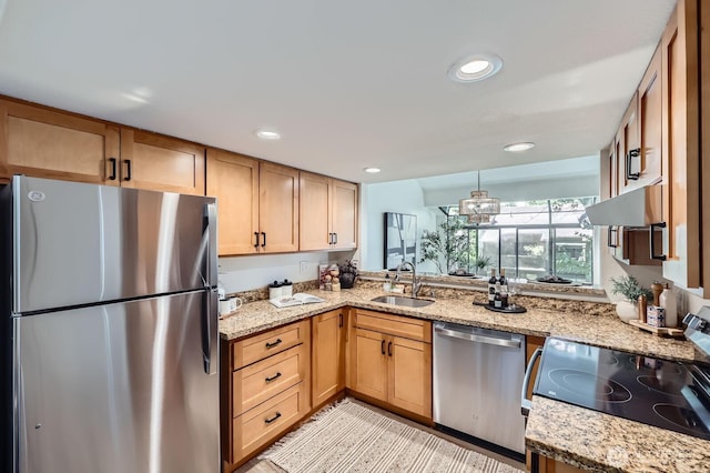 12200 100th Ave NE Unit N-D, Kirkland, WA 98034 - kitchen featuring appliances with stainless steel finishes, under cabinet range hood, recessed lighting, light stone countertops, and light brown cabinets