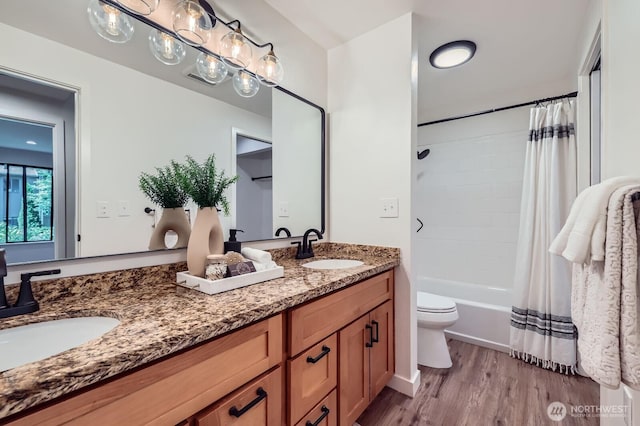 12200 100th Ave NE Unit N-D, Kirkland, WA 98034 - full bathroom with double vanity, wood finished floors, and shower / tub combo