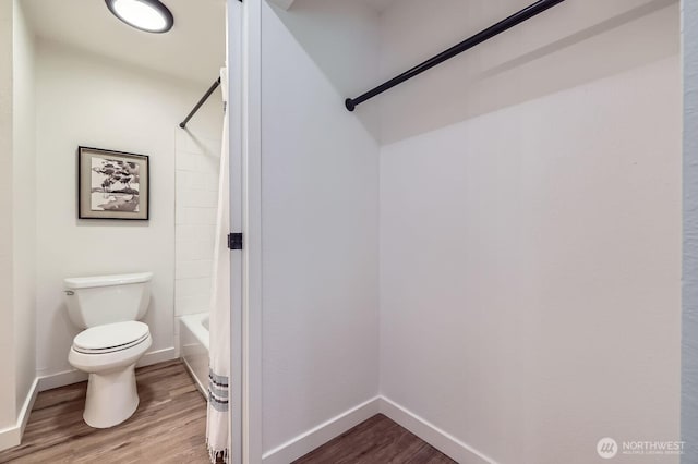 12200 100th Ave NE Unit N-D, Kirkland, WA 98034 - bathroom featuring wood finished floors and shower / bath combo with shower curtain