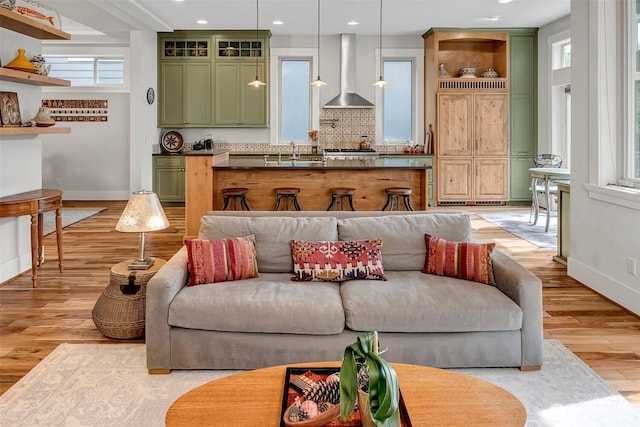 2611 9th Ave W, Seattle, WA 98119 - living room featuring light wood-style floors and recessed lighting