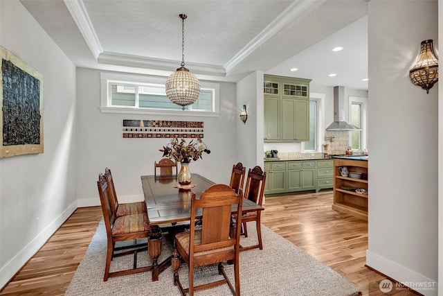 2611 9th Ave W, Seattle, WA 98119 - dining room featuring healthy amount of natural light, light wood-type flooring, a chandelier, recessed lighting, and crown molding