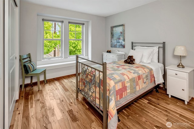 2611 9th Ave W, Seattle, WA 98119 - bedroom featuring light wood-type flooring and baseboards