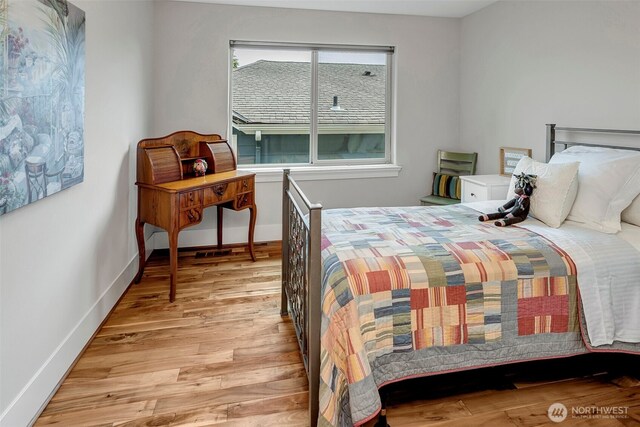 2611 9th Ave W, Seattle, WA 98119 - bedroom featuring light wood finished floors and baseboards