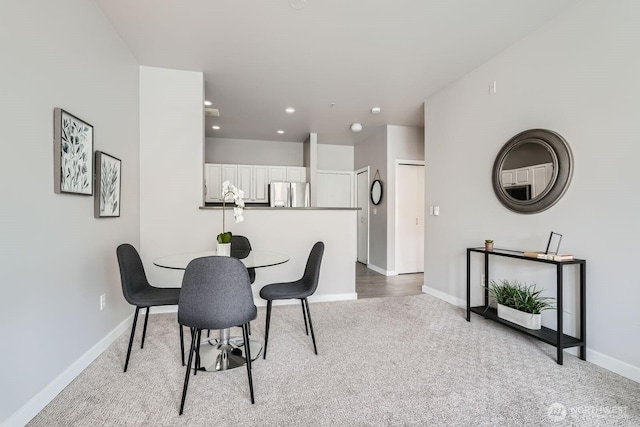 2414 1st Ave Unit 519, Seattle, WA 98121 - carpeted dining space with baseboards and recessed lighting