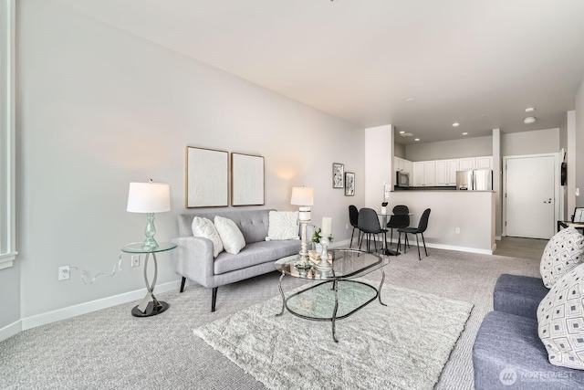 2414 1st Ave Unit 519, Seattle, WA 98121 - living area featuring light colored carpet and baseboards