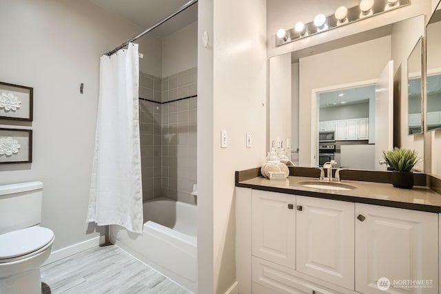 2414 1st Ave Unit 519, Seattle, WA 98121 - bathroom with vanity, wood finished floors, and shower / bath combo
