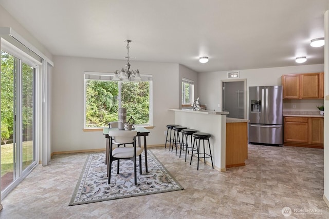 33036 42nd Ave S, Federal Way, WA 98001 - dining area featuring a chandelier and baseboards