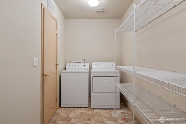 33036 42nd Ave S, Federal Way, WA 98001 - laundry area with washer and dryer and stone finish flooring