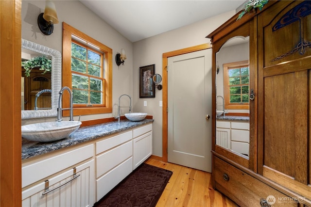 36 Seven Sisters Rd, Port Ludlow, WA 98365 - full bathroom with hardwood / wood-style flooring and double vanity