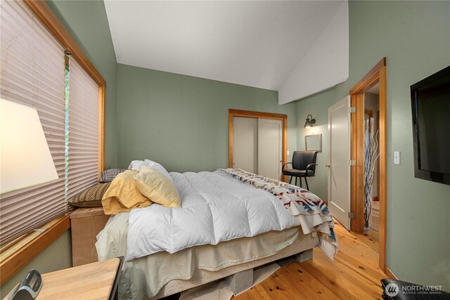 36 Seven Sisters Rd, Port Ludlow, WA 98365 - bedroom with light wood-style floors, a closet, and vaulted ceiling