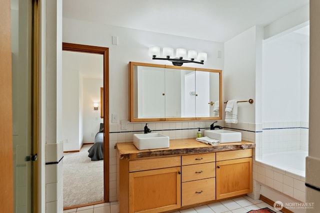 6373 Eastwood Rd, Deming, WA 98244 - full bath featuring double vanity, tile patterned flooring, and a relaxing tiled tub