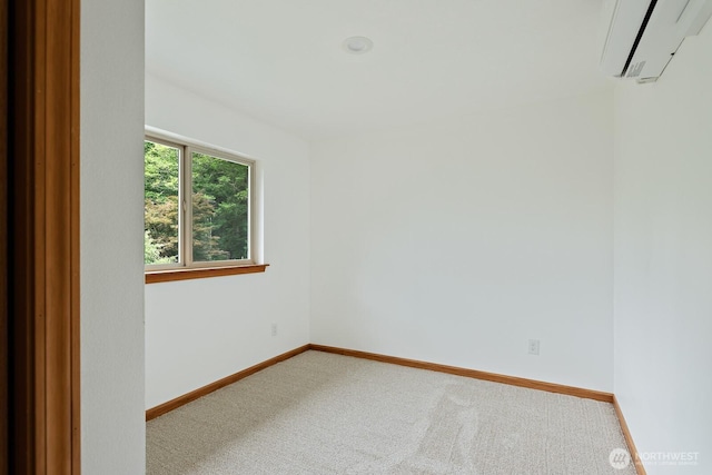 6373 Eastwood Rd, Deming, WA 98244 - carpeted empty room featuring an AC wall unit and baseboards
