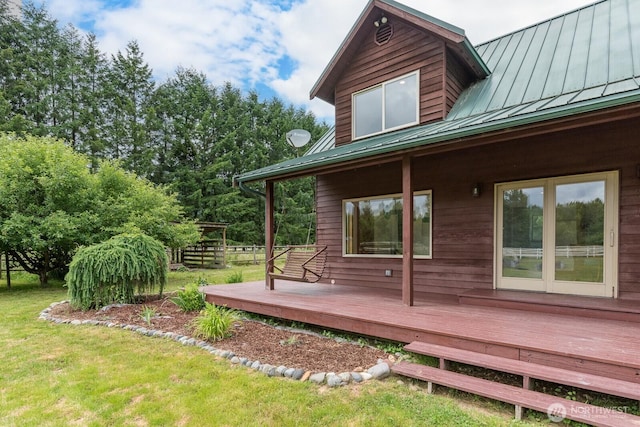 6373 Eastwood Rd, Deming, WA 98244 - view of side of property with a standing seam roof, a metal roof, a deck, and a lawn