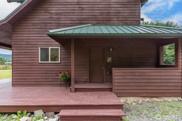 6373 Eastwood Rd, Deming, WA 98244 - view of exterior entry with a metal roof and a deck