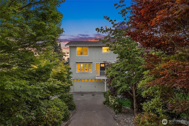 11665 NE Sunset Loop, Bainbridge Island, WA 98110 - view of front facade featuring driveway and an attached garage