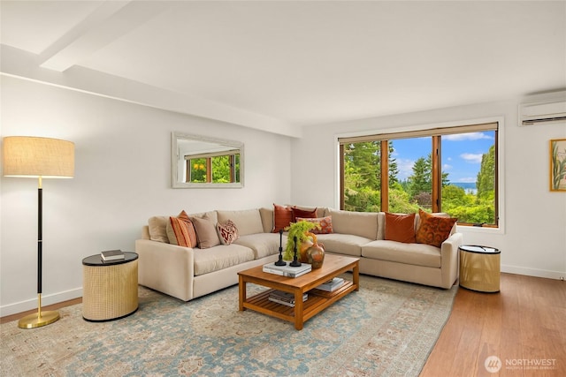 11665 NE Sunset Loop, Bainbridge Island, WA 98110 - living area featuring a wall unit AC and wood finished floors