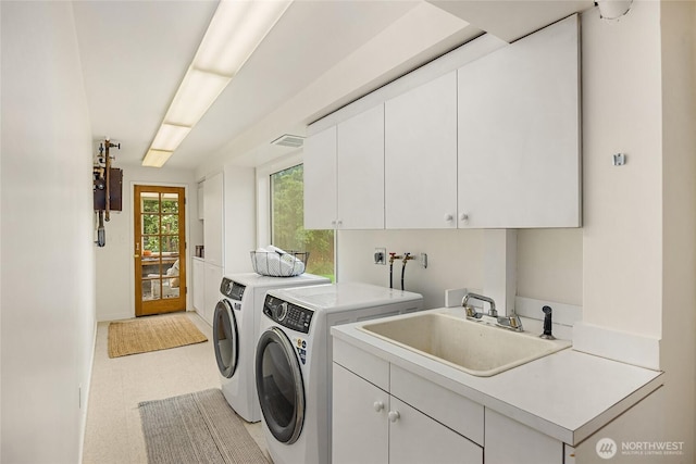 11665 NE Sunset Loop, Bainbridge Island, WA 98110 - washroom featuring cabinet space, washer and dryer, and light flooring