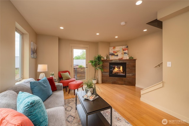 3926A S Brandon St, Seattle, WA 98118 - living room featuring recessed lighting, wood finished floors, and a tiled fireplace