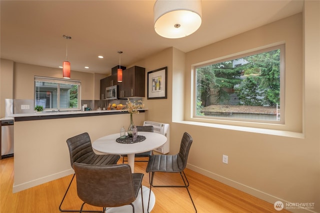 3926A S Brandon St, Seattle, WA 98118 - dining space featuring light wood-style floors and recessed lighting