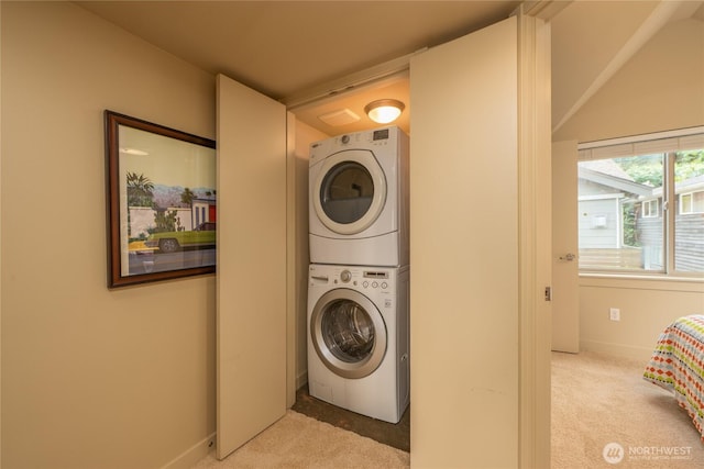 3926A S Brandon St, Seattle, WA 98118 - washroom with stacked washer and clothes dryer and carpet floors