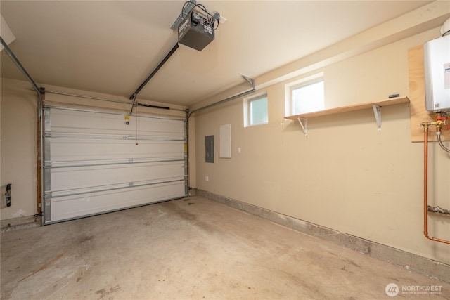 3926A S Brandon St, Seattle, WA 98118 - garage featuring a garage door opener, electric panel, and water heater