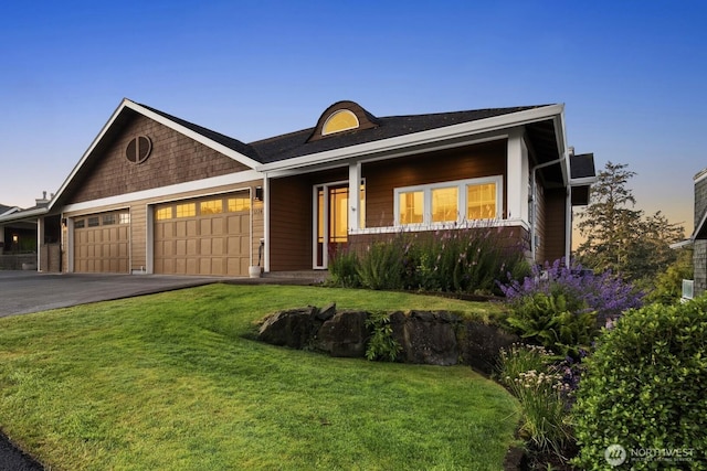 3224 Overlook Loop, Ilwaco, WA 98624 - view of front of home featuring an attached garage, a front yard, driveway, and covered porch