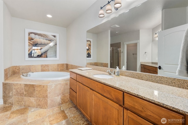 3224 Overlook Loop, Ilwaco, WA 98624 - bathroom with vanity, a garden tub, a shower stall, and stone finish flooring