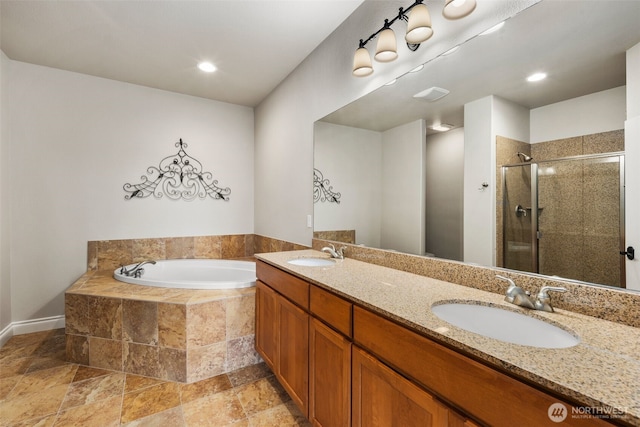 3224 Overlook Loop, Ilwaco, WA 98624 - bathroom featuring a bath, a shower stall, double vanity, stone finish flooring, and recessed lighting
