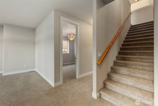 3224 Overlook Loop, Ilwaco, WA 98624 - stairs with carpet floors and a chandelier