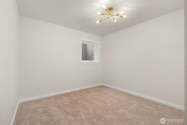 21239 15th Ave S, Des Moines, WA 98198 - spare room featuring a chandelier and carpet