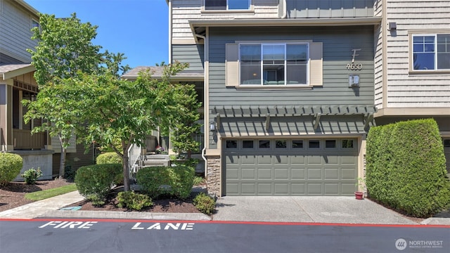 4650 NE 3rd Ln Unit F1, Renton, WA 98059 - view of front of home with an attached garage and driveway