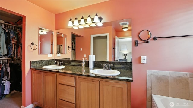 4650 NE 3rd Ln Unit F1, Renton, WA 98059 - bathroom with double vanity, a walk in closet, and a garden tub