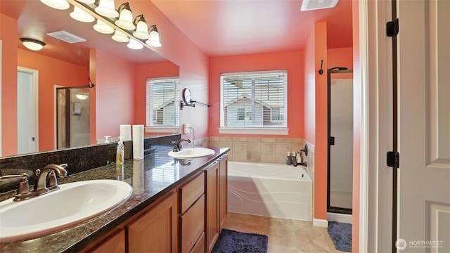 4650 NE 3rd Ln Unit F1, Renton, WA 98059 - full bath featuring a garden tub, a stall shower, tile patterned floors, and double vanity