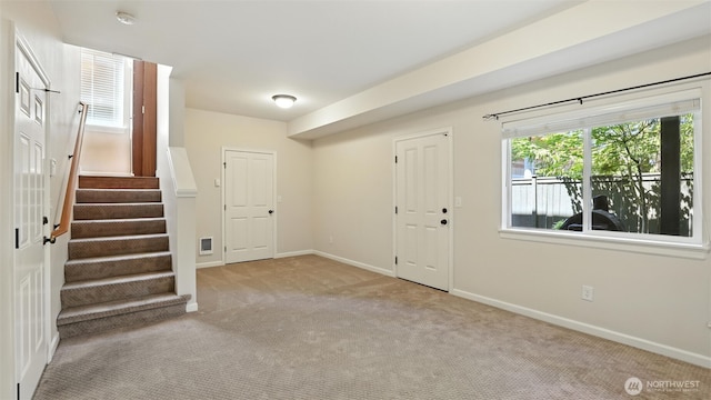 4650 NE 3rd Ln Unit F1, Renton, WA 98059 - foyer entrance featuring carpet flooring and stairs