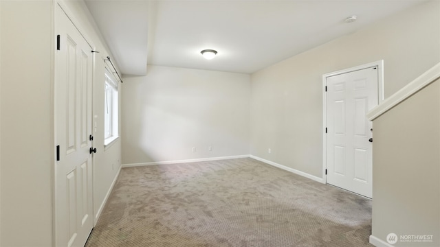 4650 NE 3rd Ln Unit F1, Renton, WA 98059 - spare room with carpet floors and baseboards