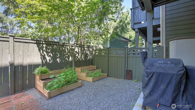 4650 NE 3rd Ln Unit F1, Renton, WA 98059 - view of patio with a vegetable garden and a grill
