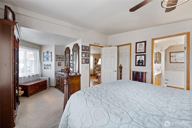 836 Harman Way S Unit 82, Orting, WA 98360 - bedroom with connected bathroom, carpet floors, and ceiling fan