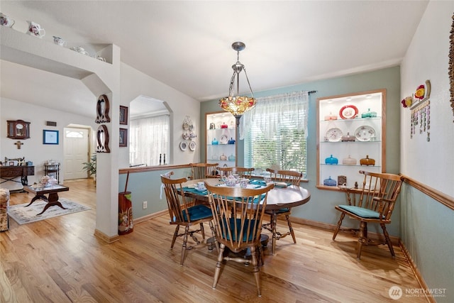 836 Harman Way S Unit 82, Orting, WA 98360 - dining room featuring light wood-style floors and arched walkways