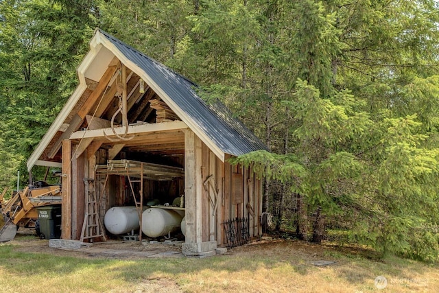 2829 Lake Langlois Rd NE, Carnation, WA 98014 - view of outdoor structure featuring a view of trees and heating fuel
